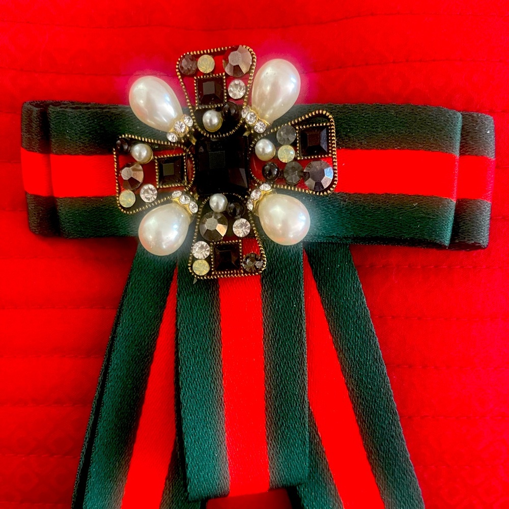 Brooch bow tie  with red green ribbon.